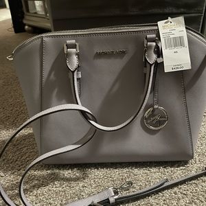 New Liliac color Michael Kors very pretty pest free home and smoke free.